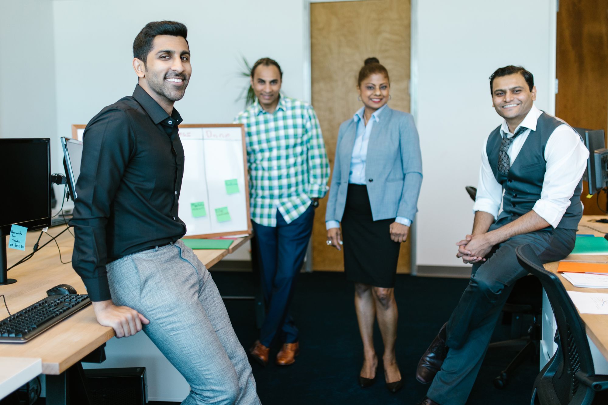 A friendly team of professionals in a bright office.